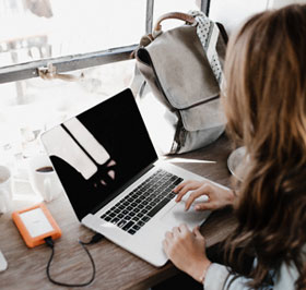 girl typing on laptop